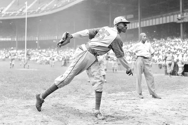 In this Aug. 2, 1942, file photo, Kansas City Monarchs pitcher Leroy Satchel Paige warms up at New Yorks Yankee Stadium before a Negro League game between the Monarchs and the New York Cuban Stars. Ten years later, on Aug. 6, 1952, Paige became the oldest pitcher in major league history to pitch a complete game or shutout.
                                 AP Photo/Matty Zimmerman, File