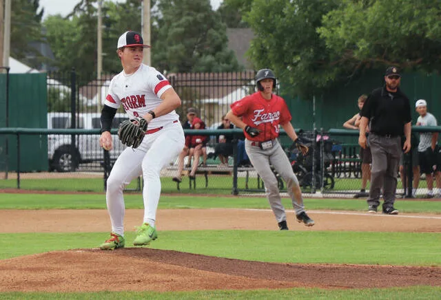 Mason Palmer pitches out of the stretch during the first Class A state championship game.
                                 Photo by Mojo Hill