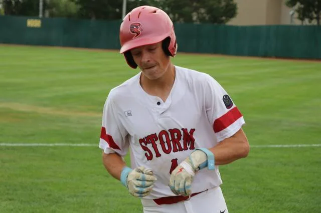 Taydon Triepke grimaces in dissapointment after making an out during an eventual loss in the first of two state championship games.
                                 Photo by Mojo Hill