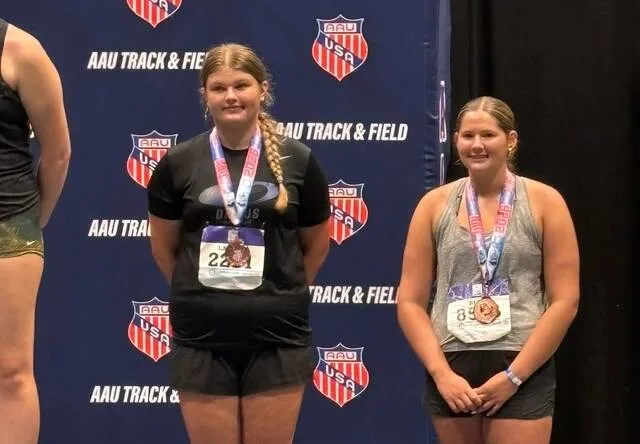 Fenja Lawson stands on the podium after placing sixth in shot put at the AAU Junior Olympic Games.
Photo courtesy of Dinius Track & Field