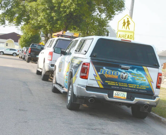 Both sides of the avenue west of CMS were filled with workers vehicles.