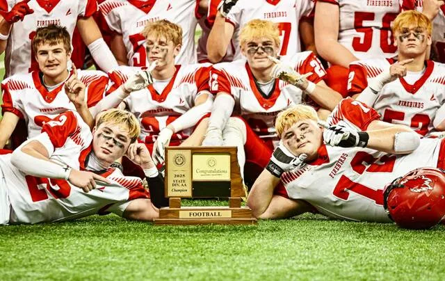 Devils Lake football players pose with the trophy after winning the 2025 Division AA state championship at the Fargodome.
Photo by Cameron Carlson