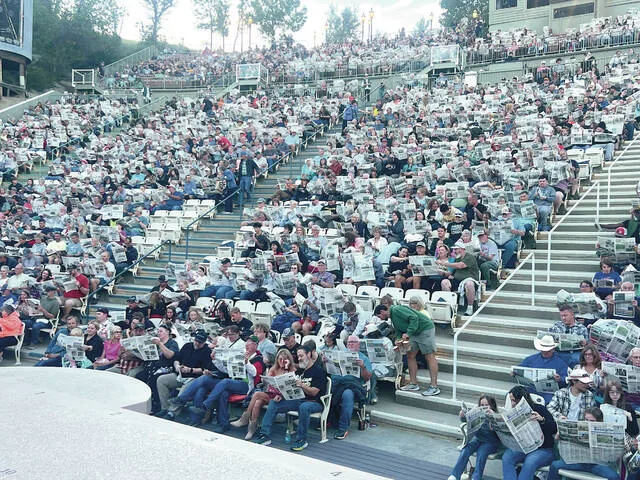 On Saturday, Aug. 15 the North Dakota Newspaper Association (NDNA) teamed up with the organizers of the Medora Musical, who were featuring a skit on newspapers, to place 2,000 newspapers beneath the seats of audience members in attendance. Before the show, after receiving a little information about NDNAs READ Local program, everyone held up their newspapers, sourced from around the state, collectively representing most of North Dakotas 71 newspapers.
Photos provided by NDNA