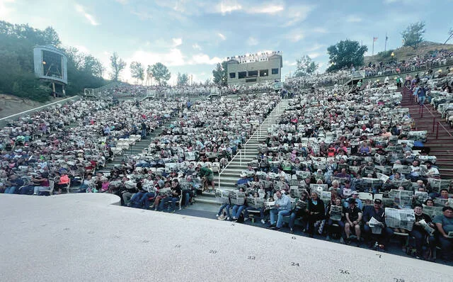 On Saturday, Aug. 15 the North Dakota Newspaper Association (NDNA) teamed up with the organizers of the Medora Musical, who were featuring a skit on newspapers, to place 2,000 newspapers beneath the seats of audience members in attendance. Before the show, after receiving a little information about NDNAs READ Local program, everyone held up their newspapers, sourced from around the state, collectively representing most of North Dakotas 71 newspapers.
Photos provided by NDNA