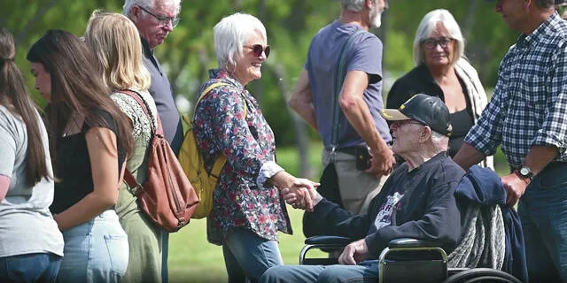 Handshake across US-Canadian border emphasizes peace and friendship
