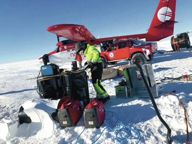 One of the team making repairs with a portable welder and taking on fuel delivered by a ski-equipped Dash 7 turboprop airplane.
                                 Photo contributed by Jon Solberg