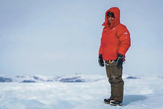 Dr. Jon Solberg surveys a field of crevasses during the E7 Greenland expedition.
                                 Photo by expedition member Scott Brady