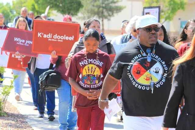 Tize W. Clark, right and his son, Zion Clark, participate in a walk to honor Native American and Indigenous relatives who have gone missing or have been killed as Missing and Murdered Indigenous Persons Awareness Day is marked in Albuquerque, New Mexico, on May 5, 2025.
                                 AP Photo/Susan Montoya Bryan,File