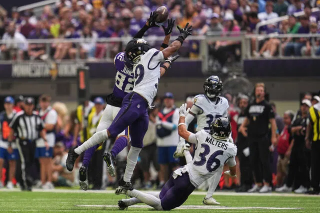 Minnesota Vikings wide receiver Jeshaun Jones (82) catches a 35-yard pass against Baltimore Ravens safety Keondre Jackson, second from left, during the first half of an NFL preseason football game, Saturday, Aug. 22, 2026, in Minneapolis.
AP Photo/Abbie Parr
