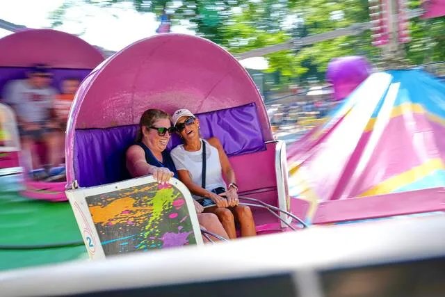 Spinning and dipping, Minnesota fairgoers delight in the classic Tilt-A-Whirl ride as it turns 100