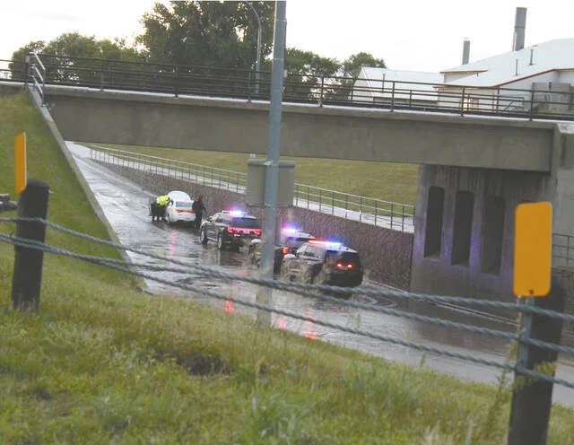 Sudden downpour floods access roads at College Drive and 6th Ave. NE