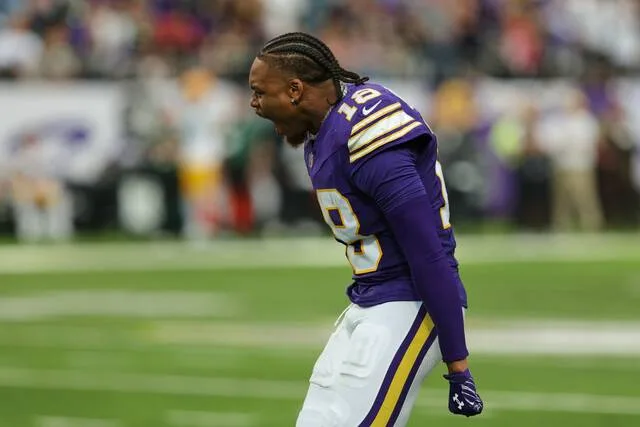 Minnesota Vikings wide receiver Justin Jefferson celebrates a defensive stop against the Green Bay Packers as he watches from the sideline during the second half of an NFL football game, Sunday, Sept. 13, 2026, in Minneapolis, Minn.
                                 AP Photo/Bailey Hillesheim