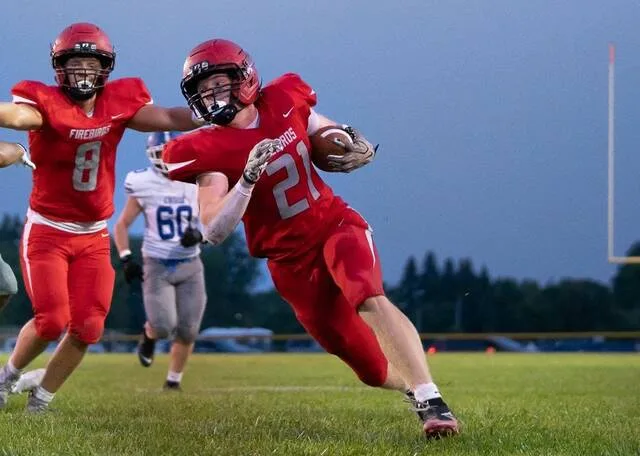 Devils Lake Football 2024 Firebirds celebration at Roller Field after beating Wahpeton 50-44