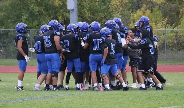 The Four Winds football team comes together in a huddle before its game against Cavalier on Friday, Sept. 25 at Four Winds High School.
                                 Photo by Mojo Hill