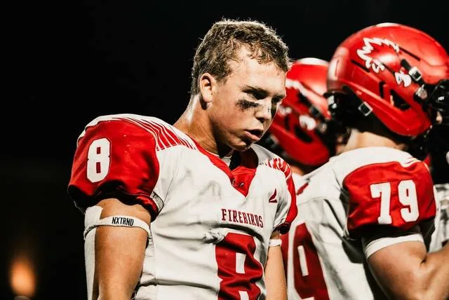 Devils Lakes Billy Enget takes a breather on the sideline during the Firebirds game against Jamestown at Charlotte Gordon and Hansen Stadium on Friday, Sept. 25.
Photo by Cameron Carlson