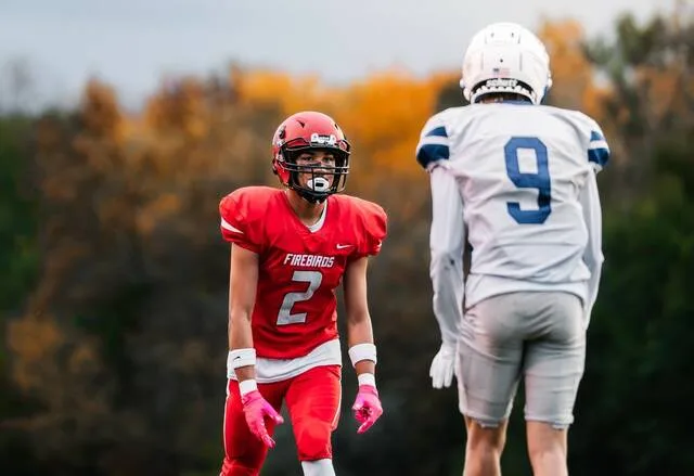 Domingo Engberg matches up with a Saints player during Devils Lakes game against Bismarck St. Marys at Roller Field on Friday, Oct. 2.
                                 Photo by Cameron Carlson